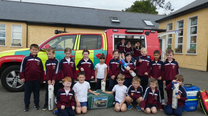 Timoleague National School’s first class children getting to know some of the medical equipment on board the West Cork Rapid Response jeep on its visit to the school last week.