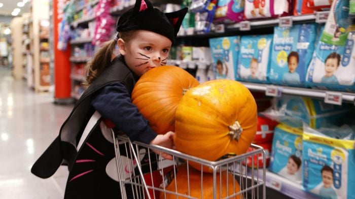 Heidi Murphy (2) pushing small shopping trolley with pumpkins at Brosnan’s supermarket in Schull. (Photo: Carlos Benlayo)