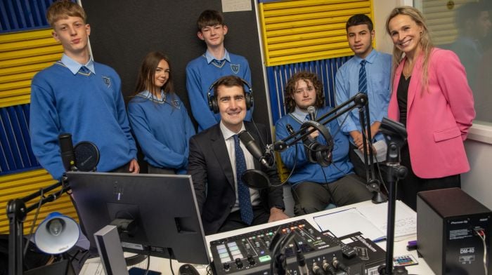 Kinsale Community School students Younis Massalme, Katie Mullaney, Callum Price, AJ Butterly and Amir Al-Nasr with Minister Jack Chambers and deputy principal Kathleen O'Brien during the Minister’s visit to the school last week.