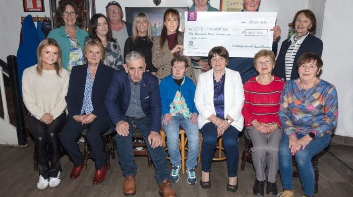 Connonagh Community Development Association held a cake sale in June and the proceeds of €1,350 were donated to the Cope Foundation on September 28th. At the presentation ceremony at the Beehive Bar were (back, from left): Maírín O'Donovan, Fiona Long, Finin O'Driscoll, Mary Ellen, Fiona Murray, Tony McCarthy, James Nyhan and Maria Nyhan. Front (from left): Amy, Maureen O'Meara, Sean Harrington, Mary Sheehan, Mary O'Driscoll, Mary Kingston and Abina Long.