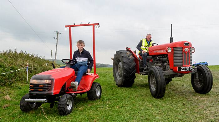 Jack and Maurice Collins (Rosscarbery) both driving red tractors (Maurice was driving a Massey Ferguson 65) at Rathbarry and District Vintage Club’s recent tractor, truck, car and motorcycle run which was followed by a classic silage baling and threshing working day at O’Donovan’s Bar, Fishers Cross.  The run this year was held in memory of former club member, Anthony Doolan.   (Photo: David Patterson)