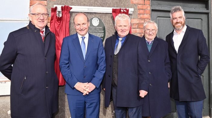 At the unveiling of the plaque on the wall of the old Station House, Ballineen in honour of Dick Barrett were (from left): Finbarr Walsh (Dick Barrett commemoration committee), Tánaiste Micheál Martin, Liam Murphy and Chris Walsh (Dick Barrett commemoration committee) and Christopher O’Sullivan TD. (Photo: Martin Walsh)