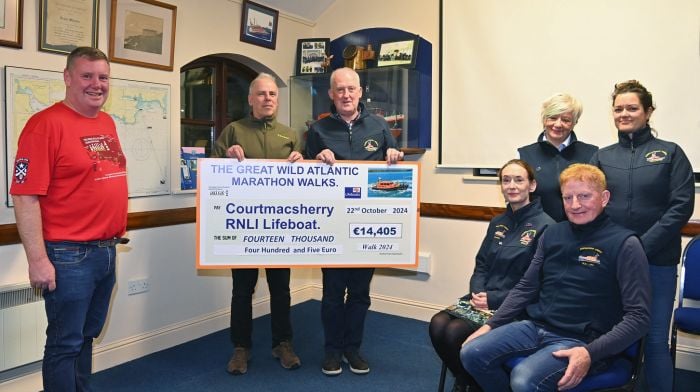 Richard O’Flynn (Great Wild Atlantic Marathon Walks committee) presenting a cheque of €14,405 to Liam Murphy (treasurer, Courtmacsherry RNLI).  The funds are the proceeds of the joint initiative between the Courtmacsherry Lifeboat Station and the Barryroe GAA Club in the promotion of the Respect the Water campaign. Also included are (from left) walks committee members Paul O’Regan, Angela O’Donovan-Veldman and Aoife Daly and seated (from left) Vincent O’Donovan and Fiona O’Flynn.  (Photo: Martin Walsh)