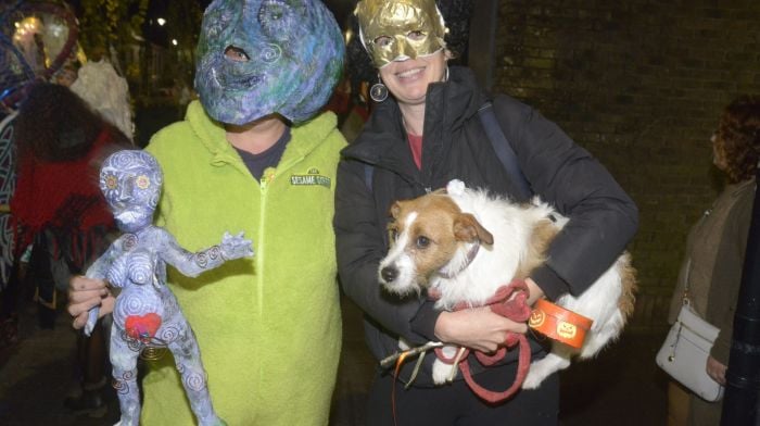 Dinny Wheeler and Gabby Pearson with Farraige the dog at the Banshee festival parade in Bandon.   (Photo: Denis Boyle)