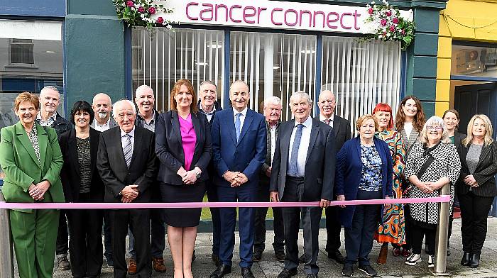 An Tanaiste Micheál Martin TD (centre) flanked by office manager Helen O'Driscoll and board chairperson Neilie O'Leary, along with members of the board and staff at the official opening of the new Cancer Connect office in Bantry.  (Photo: David Keane)