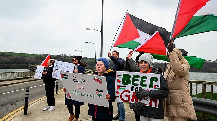 Members of the Kinsale for Palestine group out on the Archdeacon Duggan bridge encouraging motorists to show their support by sounding their horns back in March. (Photos: John Allen)