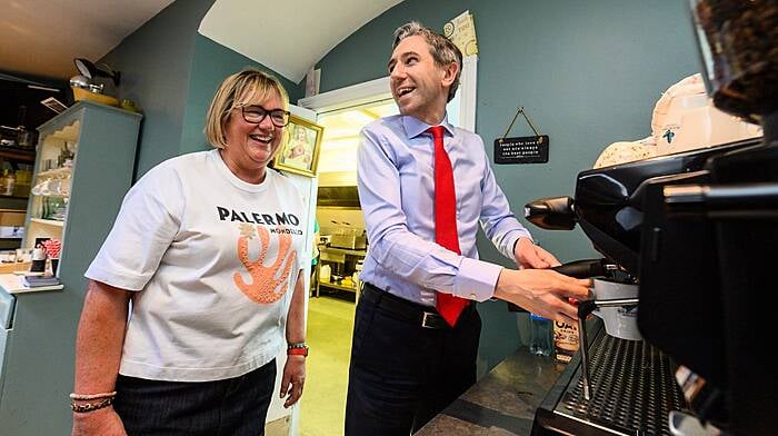 Taoiseach Simon Harris making a coffee with FG Cllr Marie O’Sullivan in her café Salvis, during a visit to Kinsale in May ahead of the local elections (Photos John Allen)