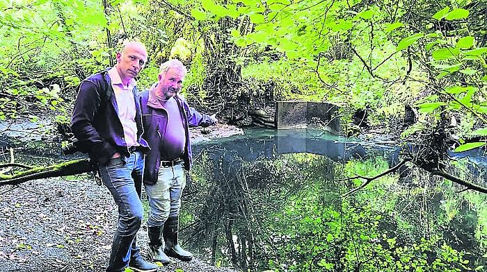 Paul Di Rollo and Conor Cahalane of the Dunmanway Waste Water Action group at the outfall point showing where effluent escaped into the Bandon River. Locals have been campaigning for an urgent upgrade of the town’s wastewater plant.