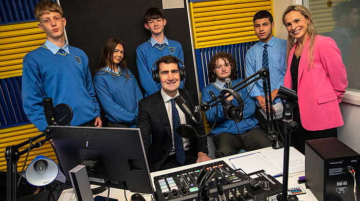 In October, Younis Massalme, Katie Mullaney, Callum Price, AJ Butterly, Amir Al-Nasr with Minister Jack Chambers and Deputy Principal, Kathleen O'Brien of Kinsale Community School