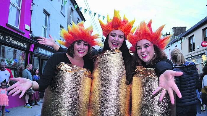 Bernadette O’Mahony, Marie Flanagan and Catherine Casey, otherwise known as the O’Donovan sisters from Cork Road in Skibbereen dressed as the Olympic flames at the amazing Olympic Street Party at Skibbereen Arts Festival during the summer. 
(Photo: Anne Minihane)