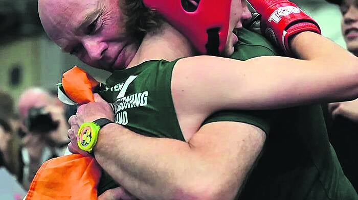 Evan Collins celebrates with his dad Tom Collins after the Skibbereen teenager won gold at the WAKO Youth World Kickboxing Championships in Budapest.