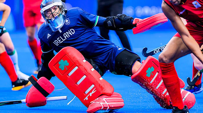 Kinsale’s David Harte makes a save for Ireland against Belgium in their Pool B opener at the Paris Olympic Games. The Irish men’s hockey goalkeeper is now a two-time Olympian. Right: Kinsale captain Jenny Murphy raises the West Cork Ladies Football Perpetual Cup after her team’s victory over Clonakilty in the Drinagh Co-Op Superstores West Cork LGFA Division 1 final in August.