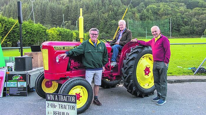 John Keohane, Tom Ryan and John Collins at Kilmacabea GAA Grounds at the draw for the restored David Brown Tractor. The 24-hour restoration project raised funds for an astro-turf pitch for the club
(Photo: Gearoid Holland)