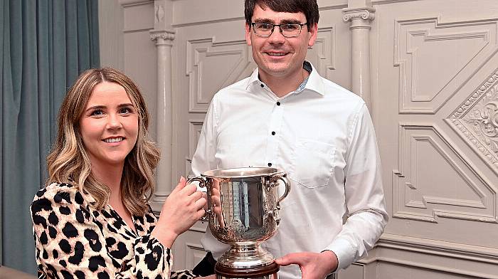 Irish tarmac rally champion Keith Cronin from Ballylickey and his wife Linda (who is expecting their first child) with the Fisher perpetual trophy at the Irish tarmac rally championship awards ceremony at the Avenue Hotel, Killarney last Saturday. (Photo: Martin Walsh)