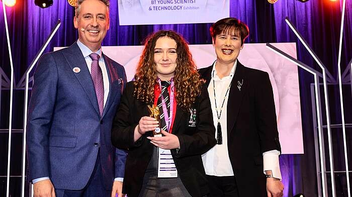 Shay Walsh, managing director, BT Ireland, and Minister for Education Norma Foley TD, presenting the runners-up (individual) award to Philippa McIntosh from Bandon Grammar School for her project on maths and dyslexic students at the BT Young Scientist of the Year competition in Dublin in January.