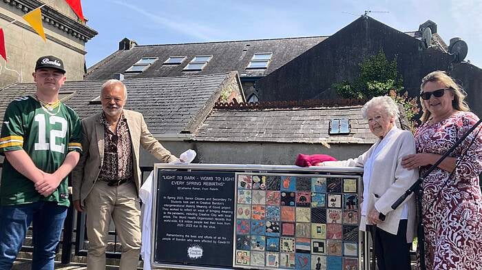 Rapper Burkie, broadcaster Graham Norton, Bridie O'Mahony of Bandon Day Care Centre and Marie Walsh HSE at the unveiling of the plaque outside the Allin Institute in June to remember those who died during Covid