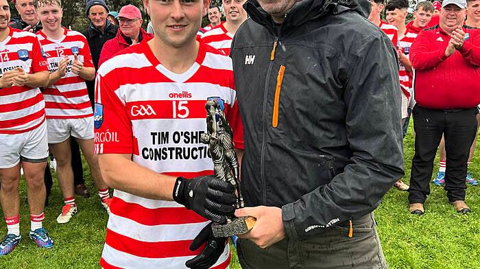 Adrigole sharpshooter Cormac Carey received his man-of-the-match award from Conor Twomey of Twomey’s Bar after inspiring his club to Beara junior B football final glory in October. Carey scored 3-3 in Adrigole’s 4-11 to 1-9 win over Glengarriff.