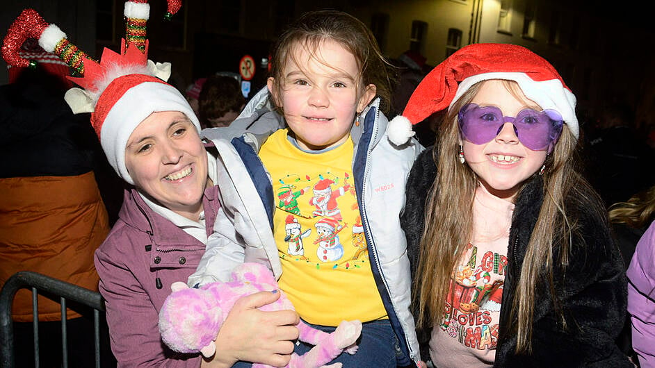 Pictured at Bandon for the arrival of Santa to switch on the Christmas Lights was Susan Nyhan with her daughters Fia and Amelia. Picture Denis Boyle