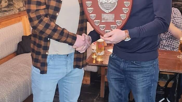 Anthony Nolan (left) presenting Barry Dwyer with the winning DeCourcey Golf Society match-play shield for 2024. The shield is now being named the Ger Nolan Shield in memory of Anthony’s late dad, Ger, who always enjoying golfing with the society.