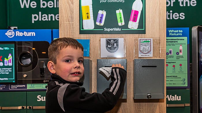 Brian Joseph Lowney from Castletownbere putting his voucher from the SuperValu’s new Re-turn scheme into the Castletownbere box.  (Photo: Anne Marie Cronin)