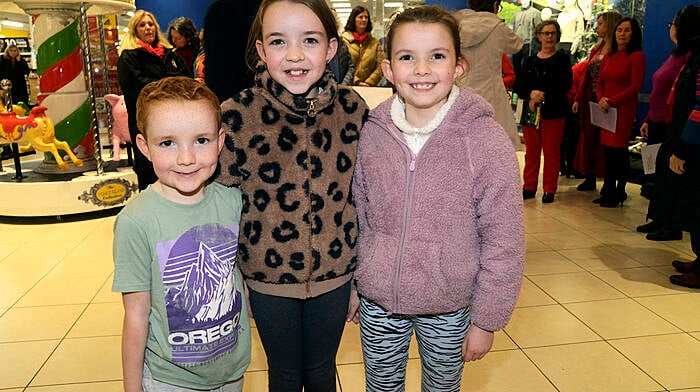 Cathal, Emma and Anna Keohane, whose grandmother Bernie Crowley was performing with the choir, at the Bandon Christmas market at Riverview Shopping Centre. (Photo: Denis Boyle)