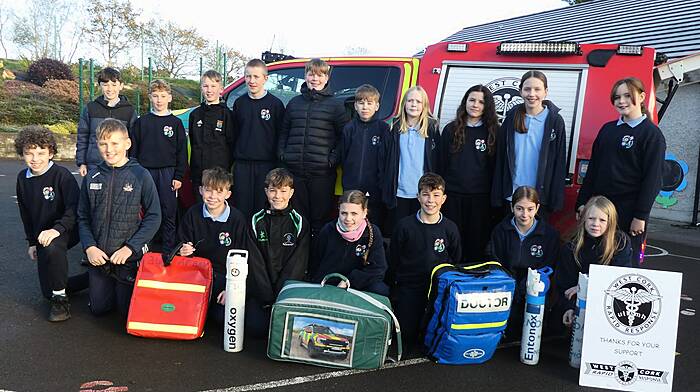 Sixth class students from Ballinadee Primary School viewing some of the emergency medical equipment on board the West Cork Rapid Response vehicle when it recently visited their school.