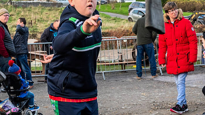 The annual old time threshing event in Tragumna, West Cork took place today at the Skibbereen Eagle pub car park. Hundreds of people attended the event which was held in aid of local charities. Trying his hand at welly wanging was Shane Duggan from Skibbereen. Picture: Andy Gibson.