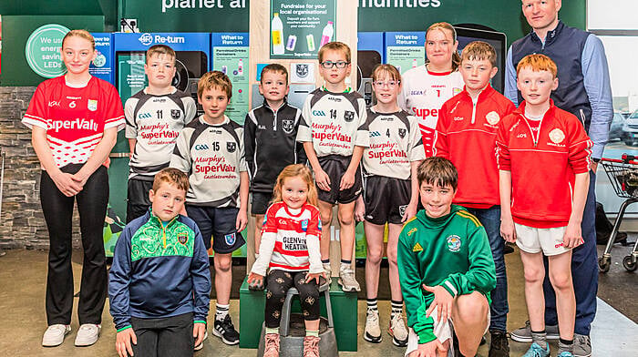 SuperValu Castletownbere has launched its fundraising return scheme and people can deposit their Re-turn voucher at the unit in store to support local organisations such as  Castletownbere GAA, Urhan GAA, Adrigole GAA, Garnish GAA, Beara ladies and Castletownbere Tidy Towns. At the launch were (back, from left): Eimear O’Shea, Conall Lowney, Luke Browne, Brian Joseph Lowney, Finnán Browne, Ashlinn Lowney, Abbie O’Shea, Danny Con O’Sullivan and Jamie O’Sullivan. Front (from left): Denis Harrington, Méabh O’Sullivan and Jack O’Sullivan.  (Photo: Anne Marie Cronin)