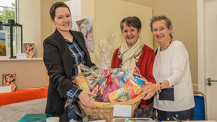 Organisers of the Darrara art group held a Christmas art and craft fair at Darrara Community Centre recently. Preparing the hamper for the raffle on the day were (from left): Deirdre Archbold, Patricia O’Brien and Mary O’Brien.(Photo: Gearoid Holland)