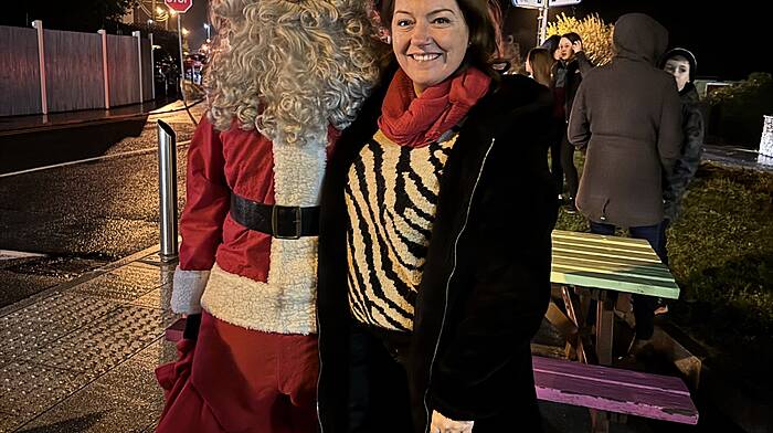 Cllr Caroline Cronin, who was instrumental in ensuring that Durrus represented County Cork in the Pride of Place competition, seen with Santa at the lighting of the village Christmas tree last Saturday night.