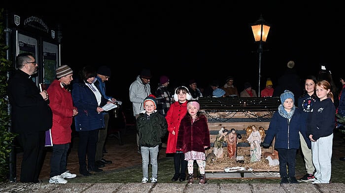 Local children at the inauguration of the Community Crib with Fr Fergus Ryan at the promenade in Courtmacsherry. Santa and Mrs Claus turned on the Christmas tree lights and the local choir provided the music and song. (Photo: Martin Walsh)