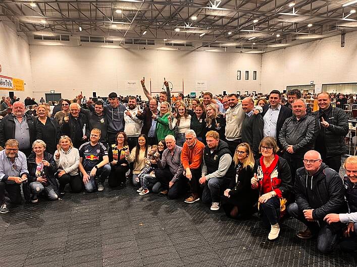 Michael Collins and his supporters celebrate his reelection at the count centre in Mallow.