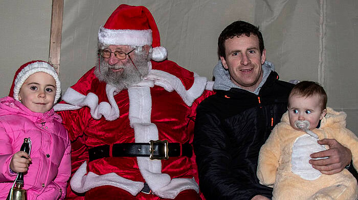 Angela, Johnny, and Jack O’Regan meet Santa Claus in Union Hall.