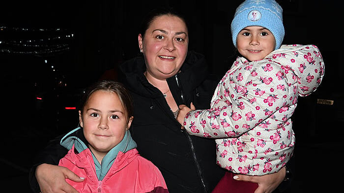 At the switching on of the Christmas lights, carol singing and Santa’s arrival in Timoleague on Sunday evening last were locals Emily, Mirela and Amy Harrington. Photo: Martin Walsh.