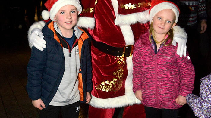 Waiting for Santa to switch on the Christmas Lights recently in Bandon were Callum and Katie Cullinane. Photo: Denis Boyle