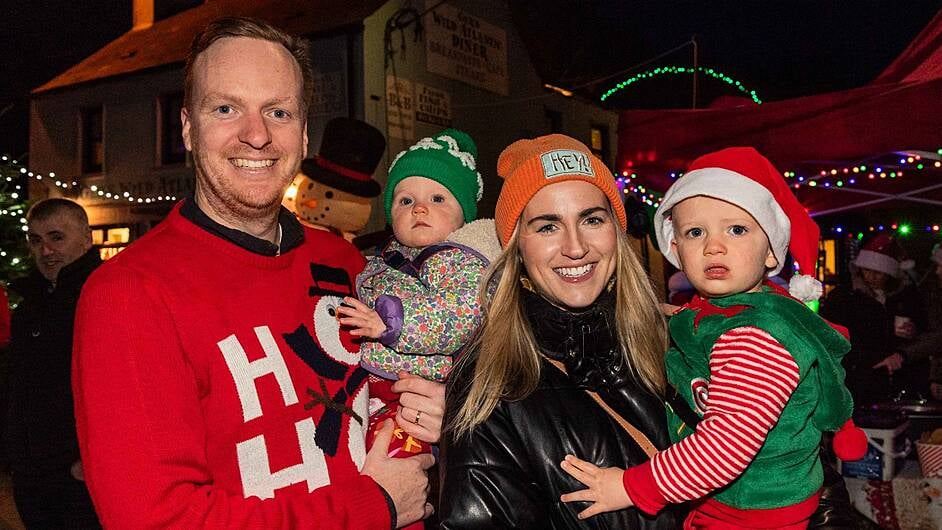 Andy, Bella, Mairéad, and Joshua Macdonald from Clonakilty enjoying the annual 'Lights Up' Parade on Saturday. (Photo: Andy GIbson)