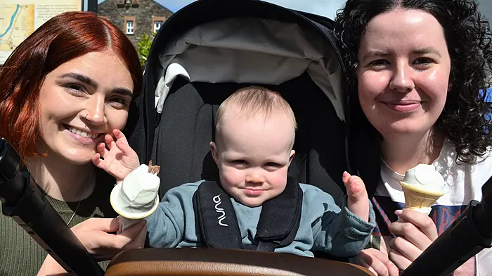 Enjoying the sunshine in Skibbereen last Saturday morning were Grainne O'Driscoll and Odhran O'Regan from Skibbereen and Laura O'Driscoll, Bantry. Photo; Anne Minihane.