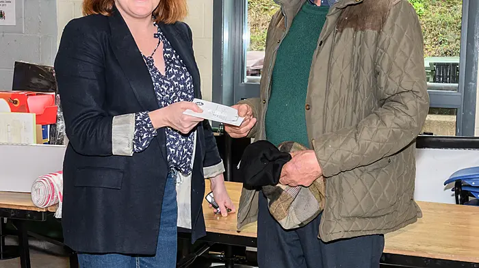 Principal Niamh McShane presenting Jerry O’Neill (Ballinadee) with his raffle prize at the Bandon Grammar School and Bandon Union of Parishes tractor, truck and car run which was held in aid of St Michael's Centre in Bandon and St Fintan's development fund.  (Photo: David Patterson)