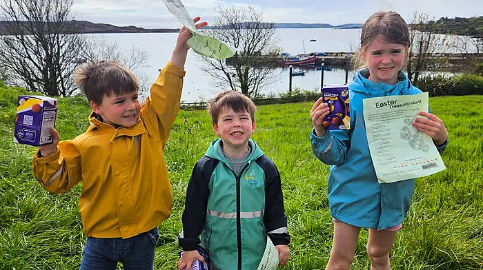 caption XXX Finn, Eoin and Olivia Twomey delighted with their Easter treasures at the Schull Easter Treasure Hunt finish line