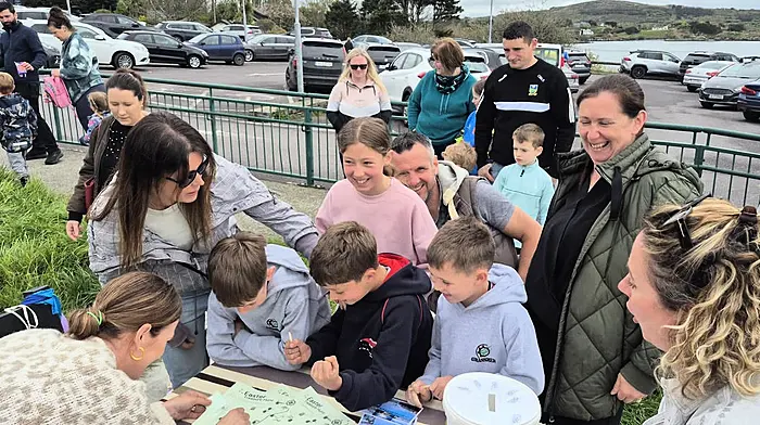 Keen egg hunters queue for clues and maps as Padraig McCarthy, Timmy Cleary, Cormac McCarthy and Kayla Cleary sign in for the  the Schull Easter Treasure Hunt organised by Schull Regatta Committee.