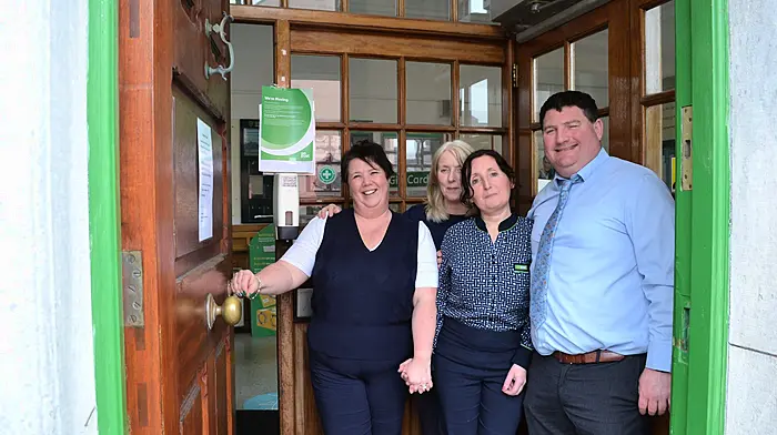 Staff members Karen McDermott, Caroline Collins, Trish O'Mahony and postmaster David Jennings at the door of the Skibbereen Post Office before it relocated to its new premises at Drinagh Euro Spar, further along Market Street in Skibbereen. (Photo: Anne Minihane)