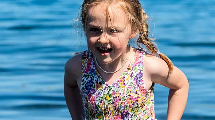 Bantry, West Cork, Ireland. 17th May, 2025. The Bantry Coastal Sculling Regatta took place at the aerodrome in Bantry today, with teams from all over West Cork competing. Playing in the water at the regatta was 5 year old Amelia Tanner from Bantry. Picture: Andy Gibson.