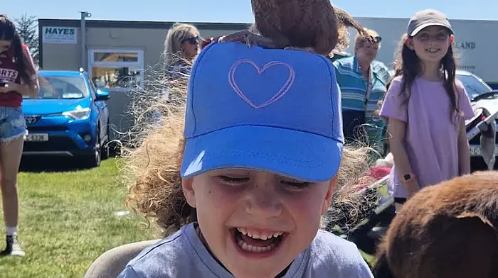 Orlaith O'Leary of Cripple Hill, Bandon enjoying Ger's Mobile Farm last Sunday at the Bandon show.