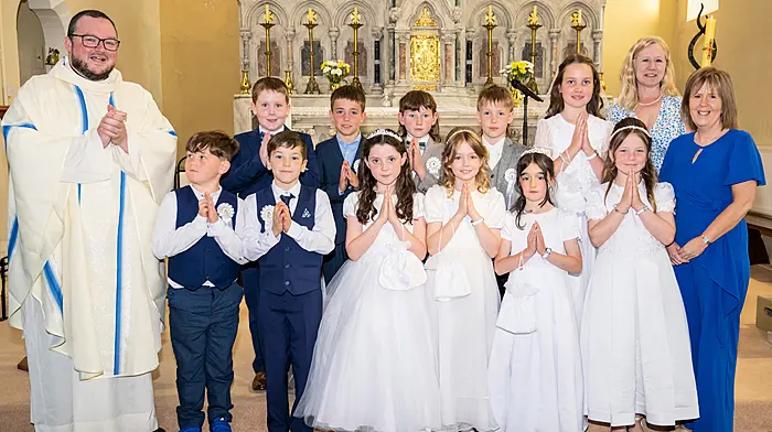 Pupils of Carrigboy NS received their First Holy Communion at the Sacred Heart Church in Durrus last Sunday. Back: Fr Ben Hodnett, Eoghan Ward, Stephen O'Keeffe, Peadar Williamson, Oisín McNulty, Sadie Ward, Ms Elizabeth Mee and  Ms Carina Hurley. Front: Kristian Levis Alford, Alex Coughlan, Caoimhe Deacy, Clodagh McCarthy, Hanna O'Driscoll and Tiah Carroll O'Driscoll.  Photo courtesy of Donal O'Connell.