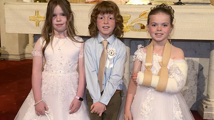 Kilcolman NS pupils Jane Moyles, Michael Tanner and McKenna Thorne celebrating their First Holy Communion.  (Photo: Denis Boyle)