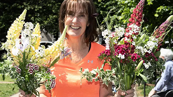 Helen Scully from Ardfield saying it with flowers in Kennedy Gardens, Clonakilty.    (Photo: Martin Walsh)