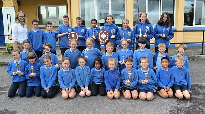 Skibbereen's Abbeystrewry National School pupils were delighted to bring home lots of trophies from the Cork City Sports primary school athletics event. The team was the overall winner of their group. Included in the photo is their principal, Jean Fuller.  (Photo: Anne Minihane)