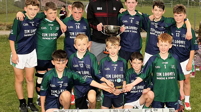 Lisheen National School, Roinn 6 Boys winners, receive the trophy from Cork footballer Maurice Shanley. (Photo: Paddy Feen)