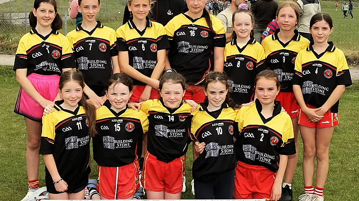 Roinn 6 Girls runners-up Caheragh NS with Cork footballer Maurice Shanley. (Photo: Paddy Feen)