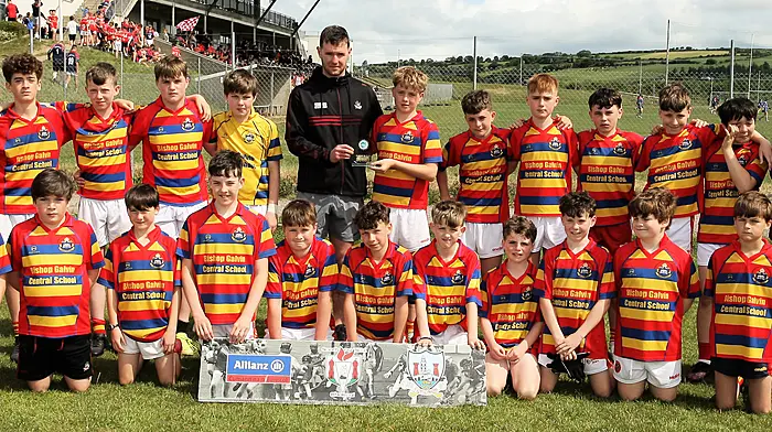Roinn 1 Boys runners-up Bishop Gavin Central School Newcestown with Cork footballer Maurice Shanley. (Photo: Paddy Feen)
